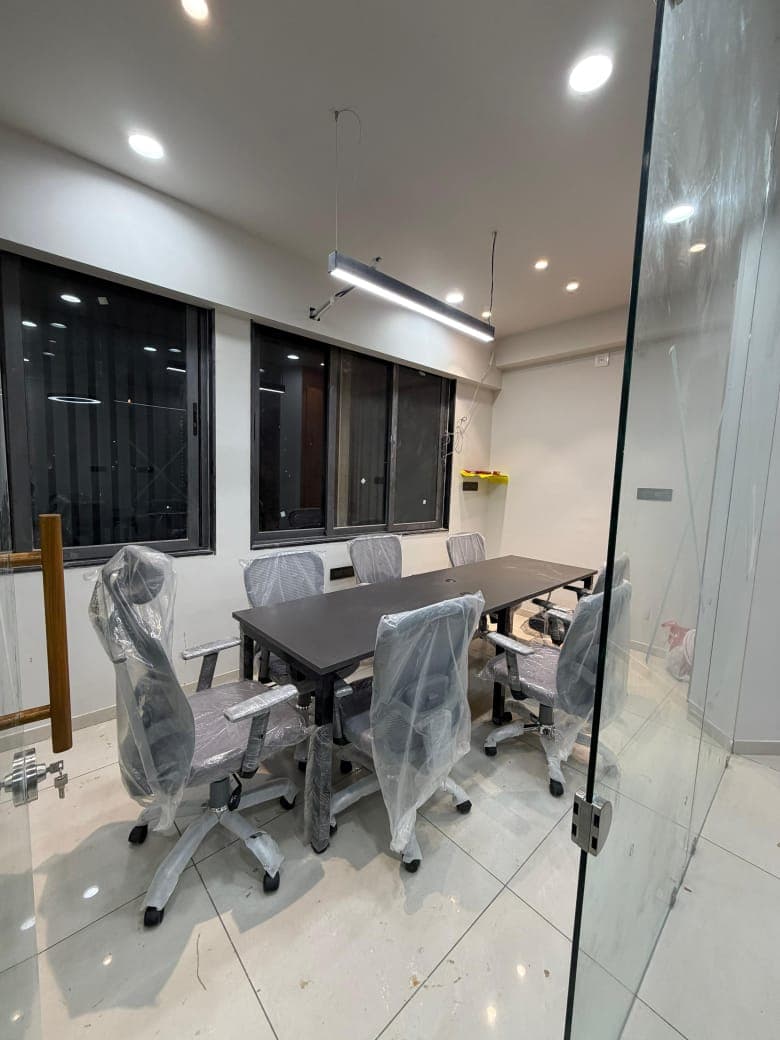 Conference Table and Chairs - custom furniture project by MistriKaam in S.G. Highway, Ahmedabad